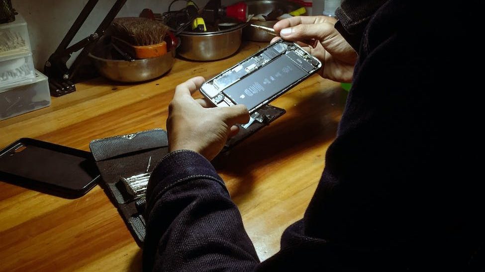 man repairing a phone